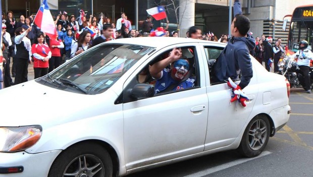 A La U fan celebrates Chile's victory. Photo: Vasilios Devletoglou